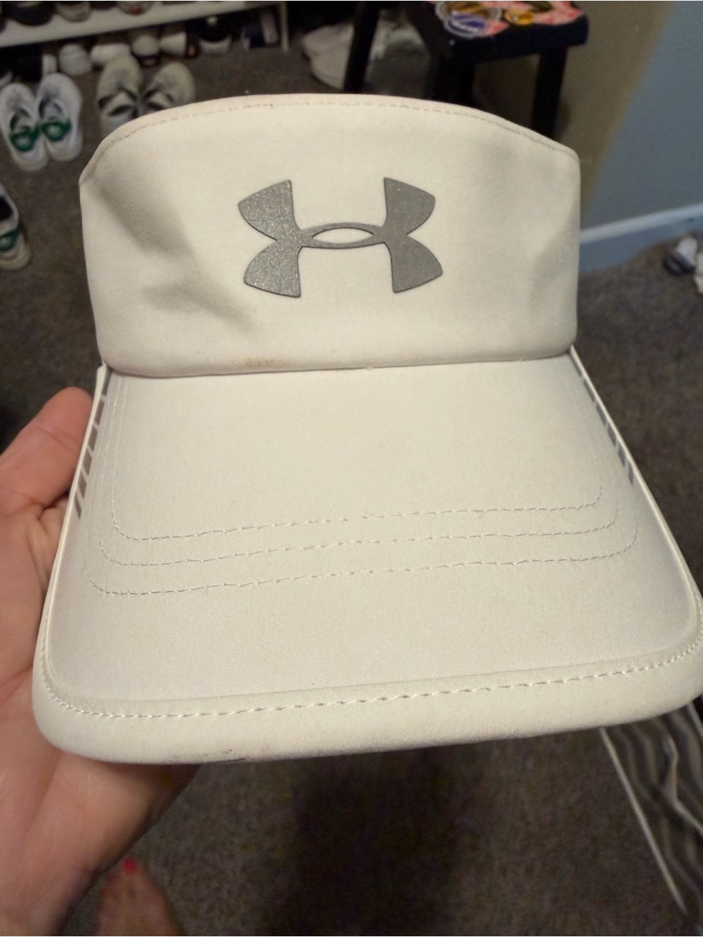 Under Amour white visor. Good condition